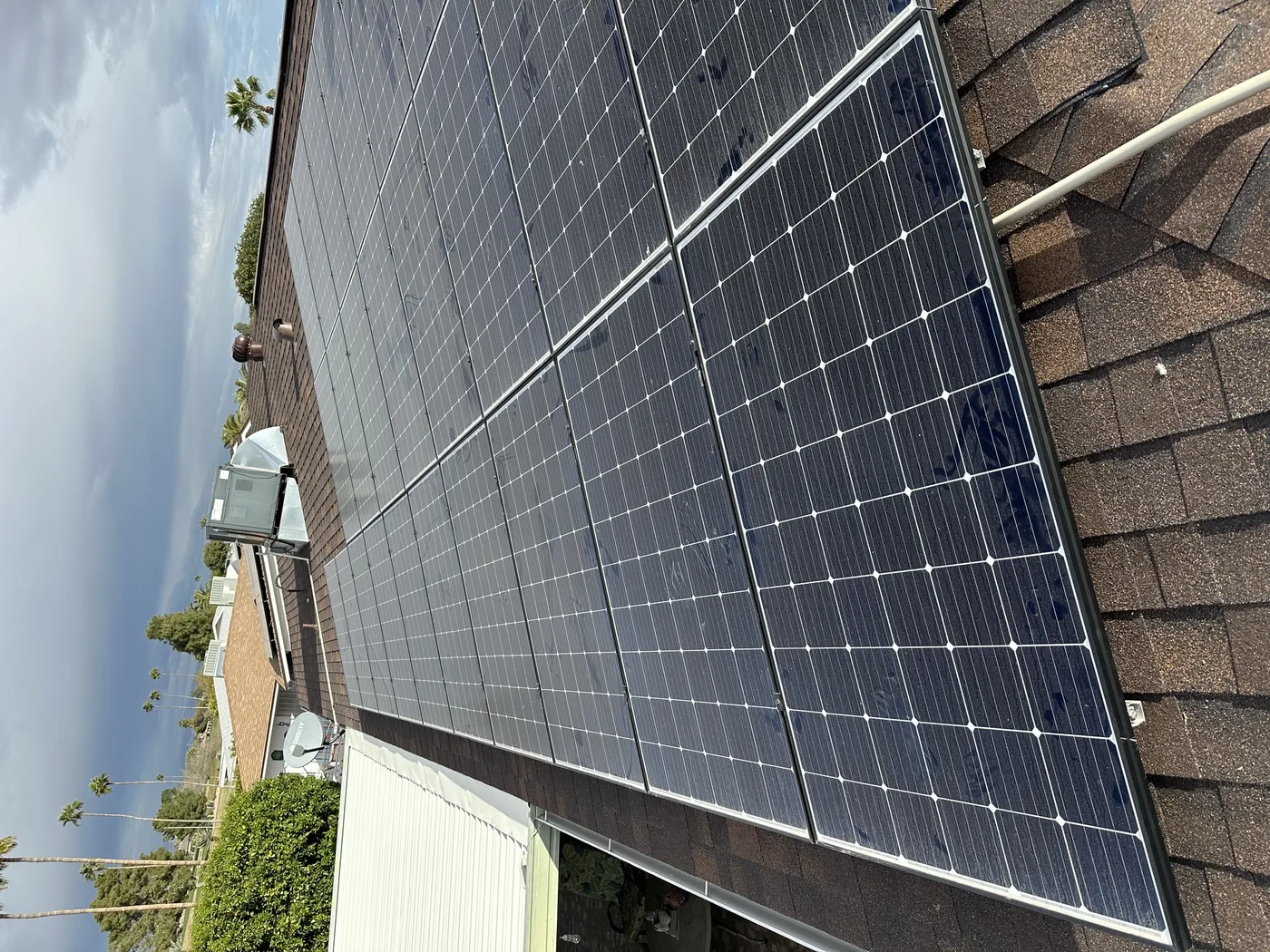 Residential solar panels arranged across a roof
