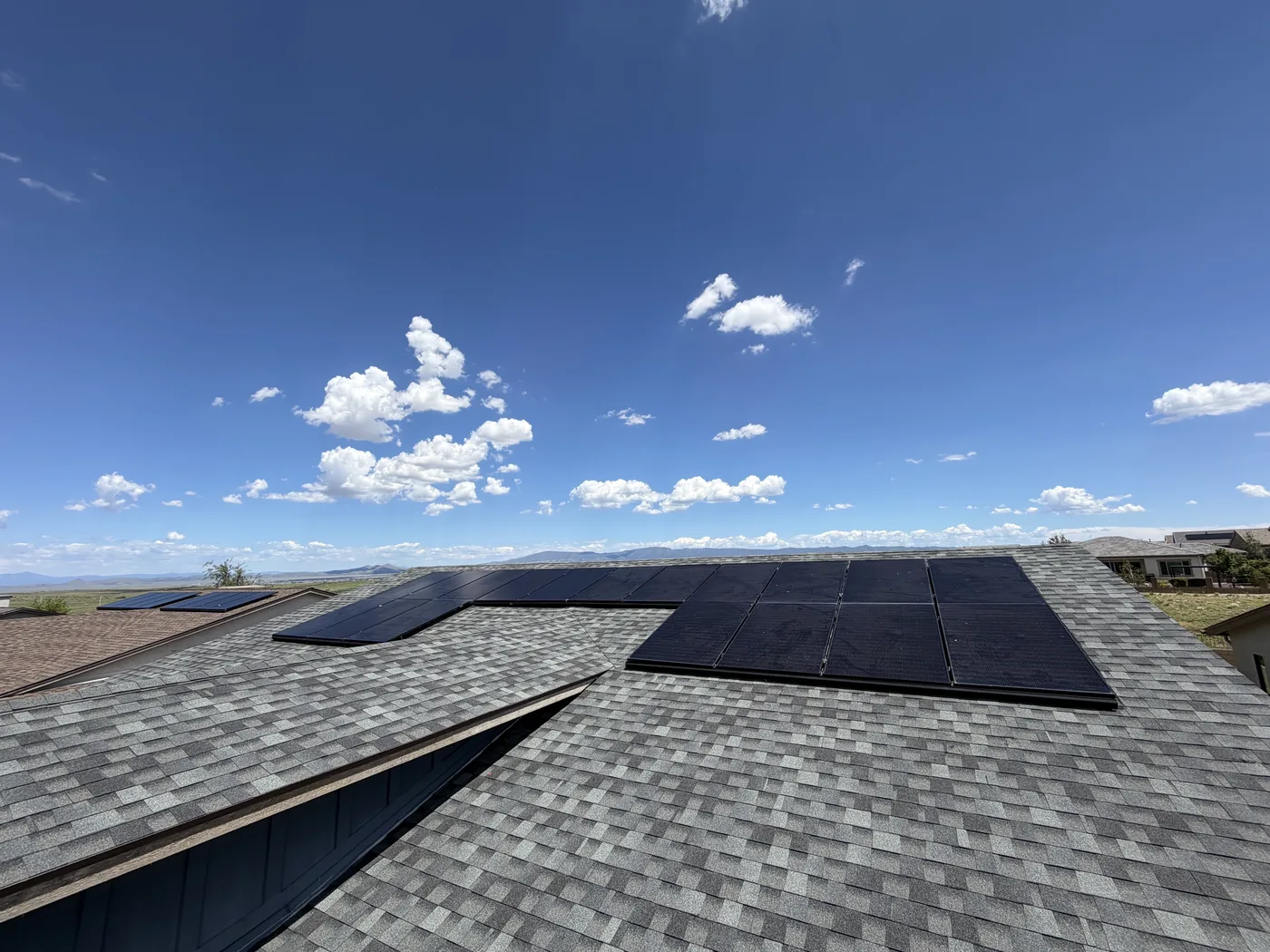 Roof-mounted solar panels with mountain views